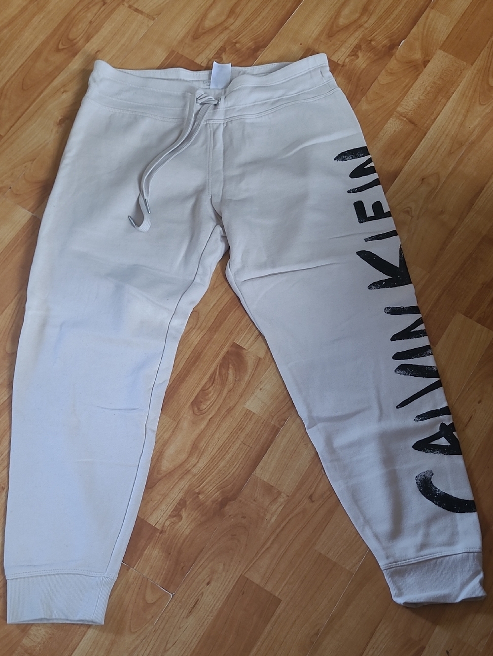 Calvin Klein Performance Cream Joggers with Black Logo Accent - Picture 1 of 5